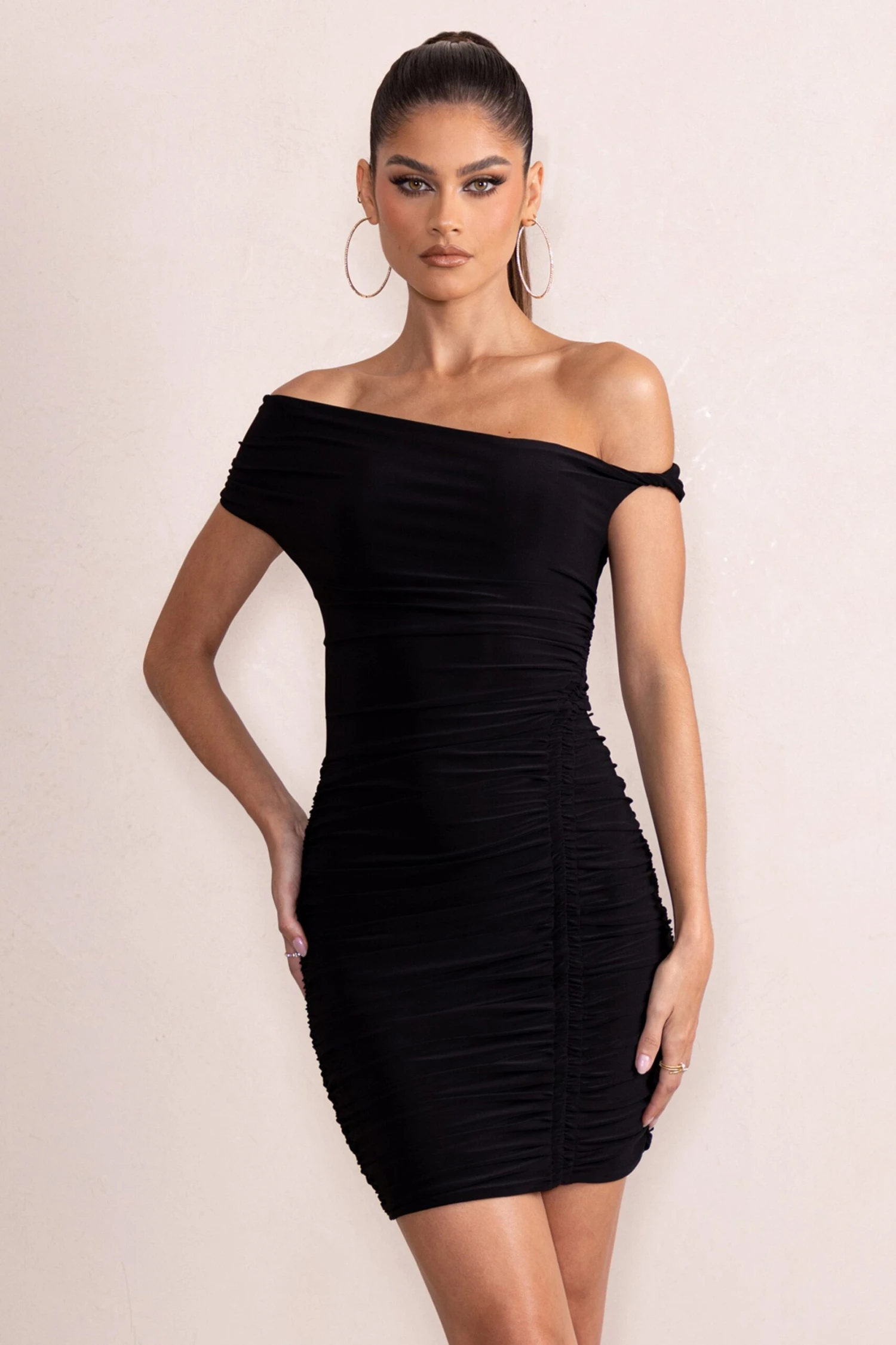 Coco | Black Asymmetric Bardot Mini Dress With Ruching Detail 7 Coco | Black Asymmetric Bardot Mini Dress With Ruching Detail - Image 5
